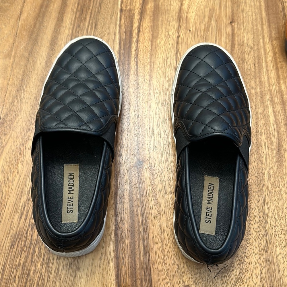 Black quilted Steve Madden slip ons